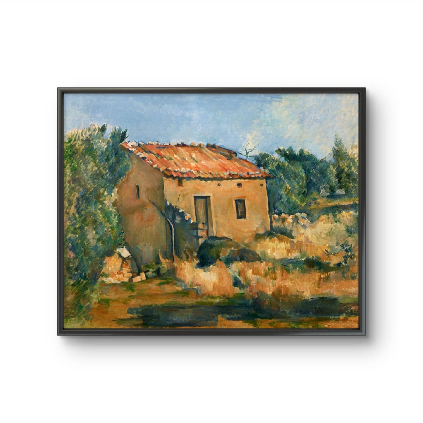 Framed painting of a rustic building with trees and landscape