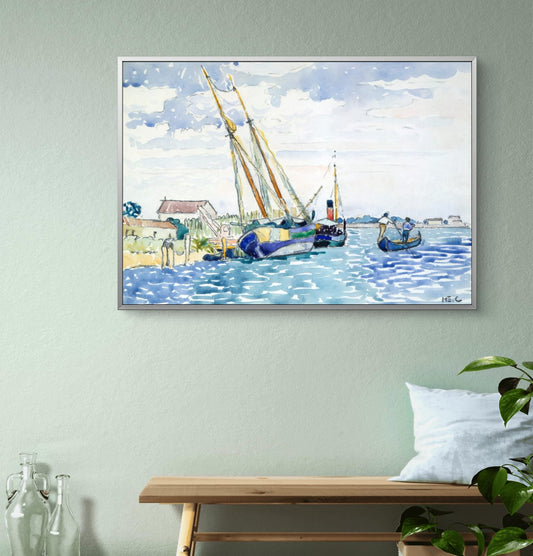 Framed painting of sailboats on a water scene hanging on a wall above a bench.