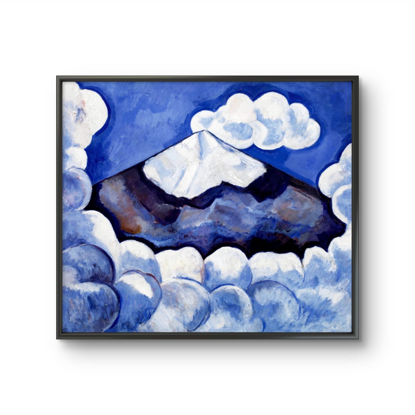 Framed artwork of a mountain landscape with blue and white tones.