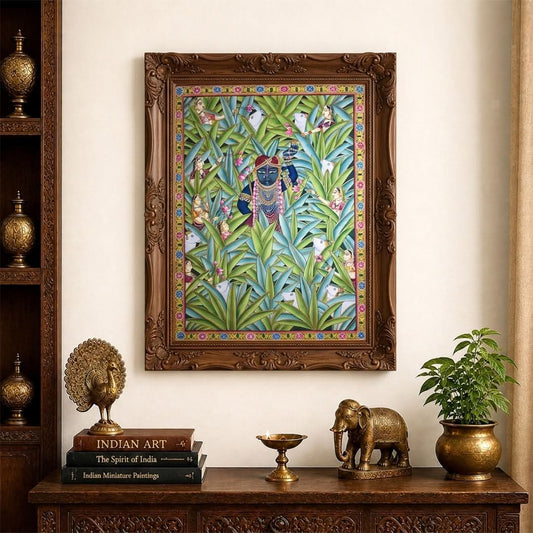 Decorative wall art with a person amidst nature, framed in an ornate wooden frame, on a wall with decorative items below.