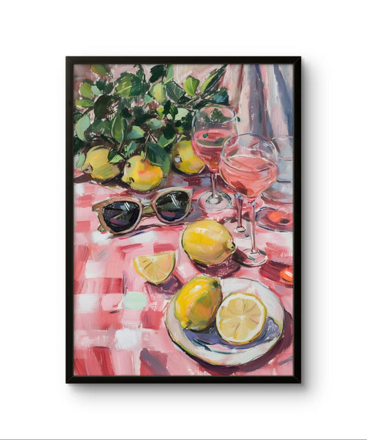 Framed artwork of a still life with lemons, sunglasses, and pink drinks on a checkered tablecloth.