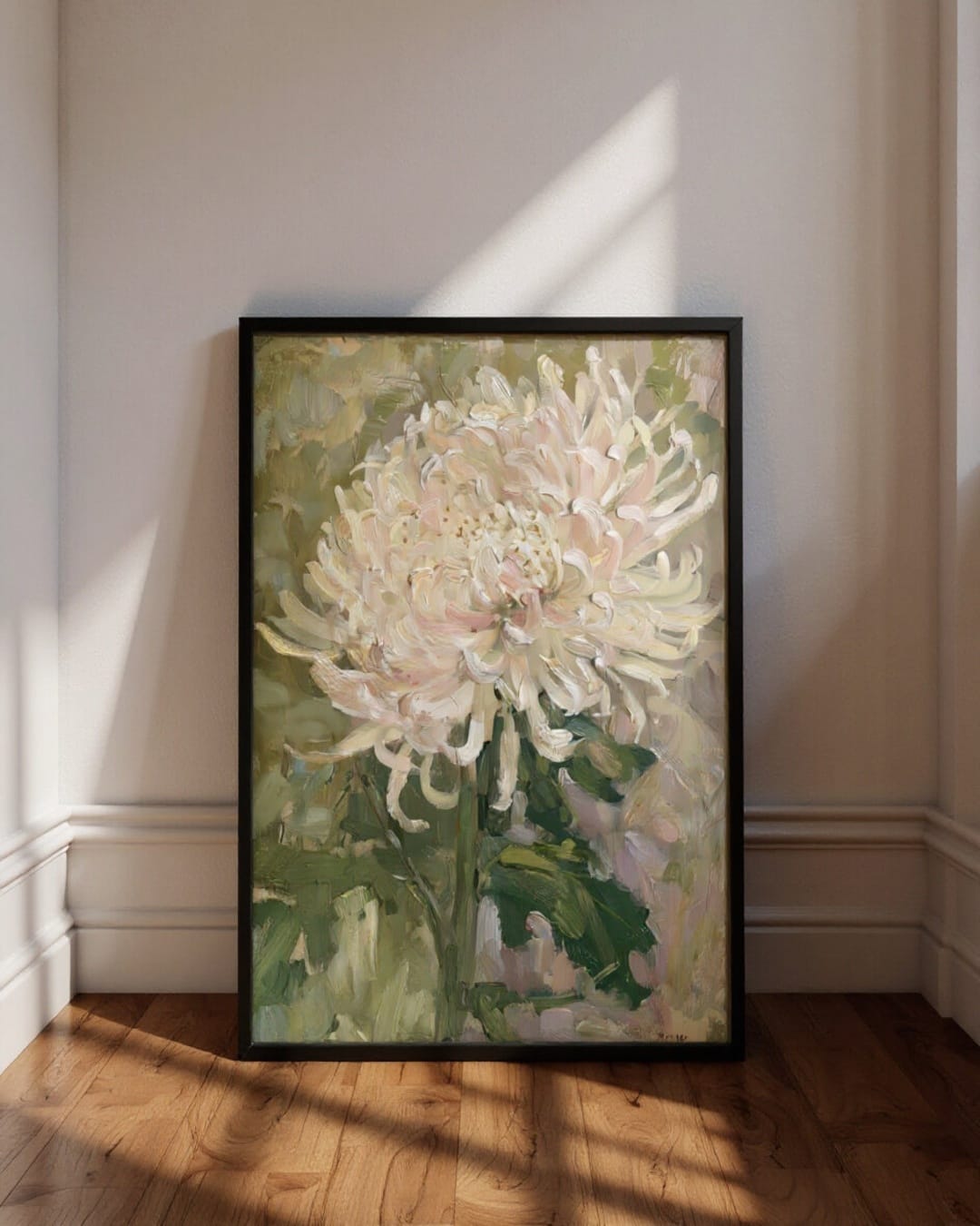Framed painting of a white flower on a wall with sunlight casting shadows.