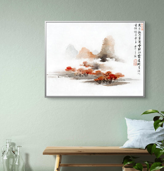 Framed abstract painting on a wall with a bench and plant below