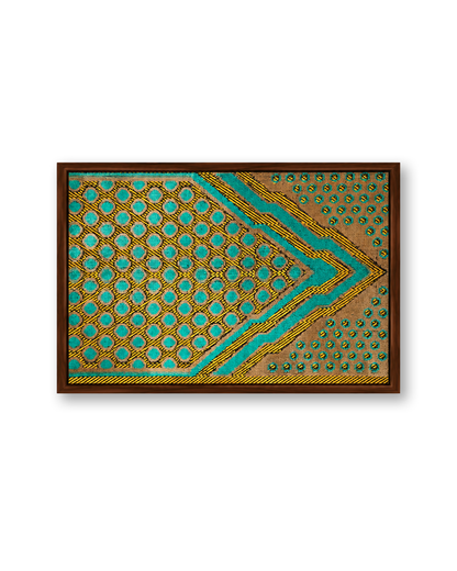 A framed square art print featuring a geometric pattern with turquoise, gold, and brown tones, set against a plain white background.