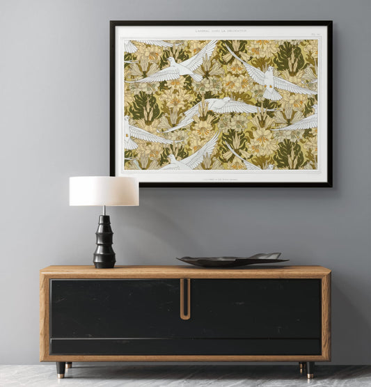 Framed artwork above a wooden console table with a lamp and decorative plate.