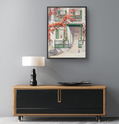 Framed artwork above a wooden console table with a lamp and decorative bowl.
