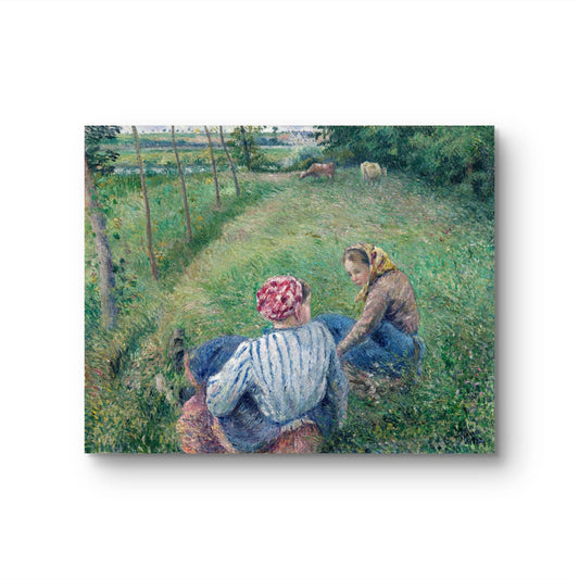 Two women sitting on a grassy path with a pastoral landscape in the background