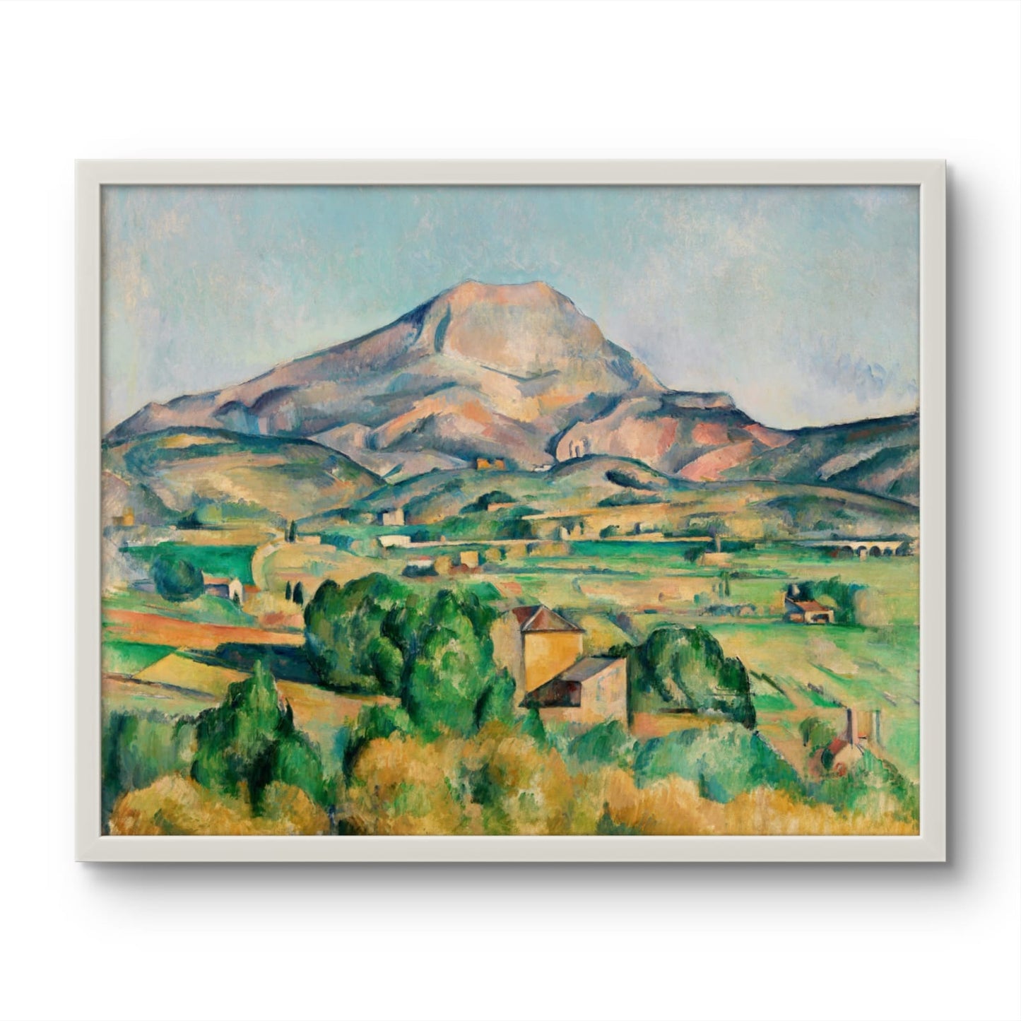 Framed painting of a mountain landscape with green fields and houses.