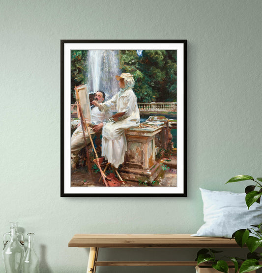 Framed painting of a couple by a waterfall on a wall above a wooden bench.