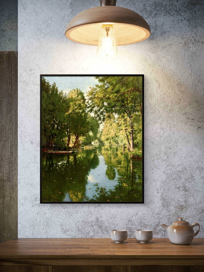 Framed nature print of a lake surrounded by trees on a textured wall above a wooden table with teacups and a teapot.