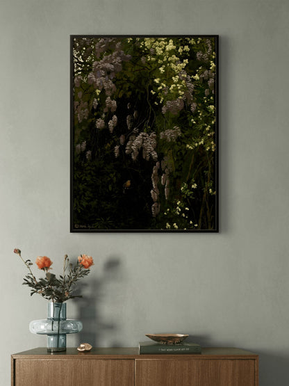 Framed botanical artwork on a wall above a wooden sideboard with decorative items.